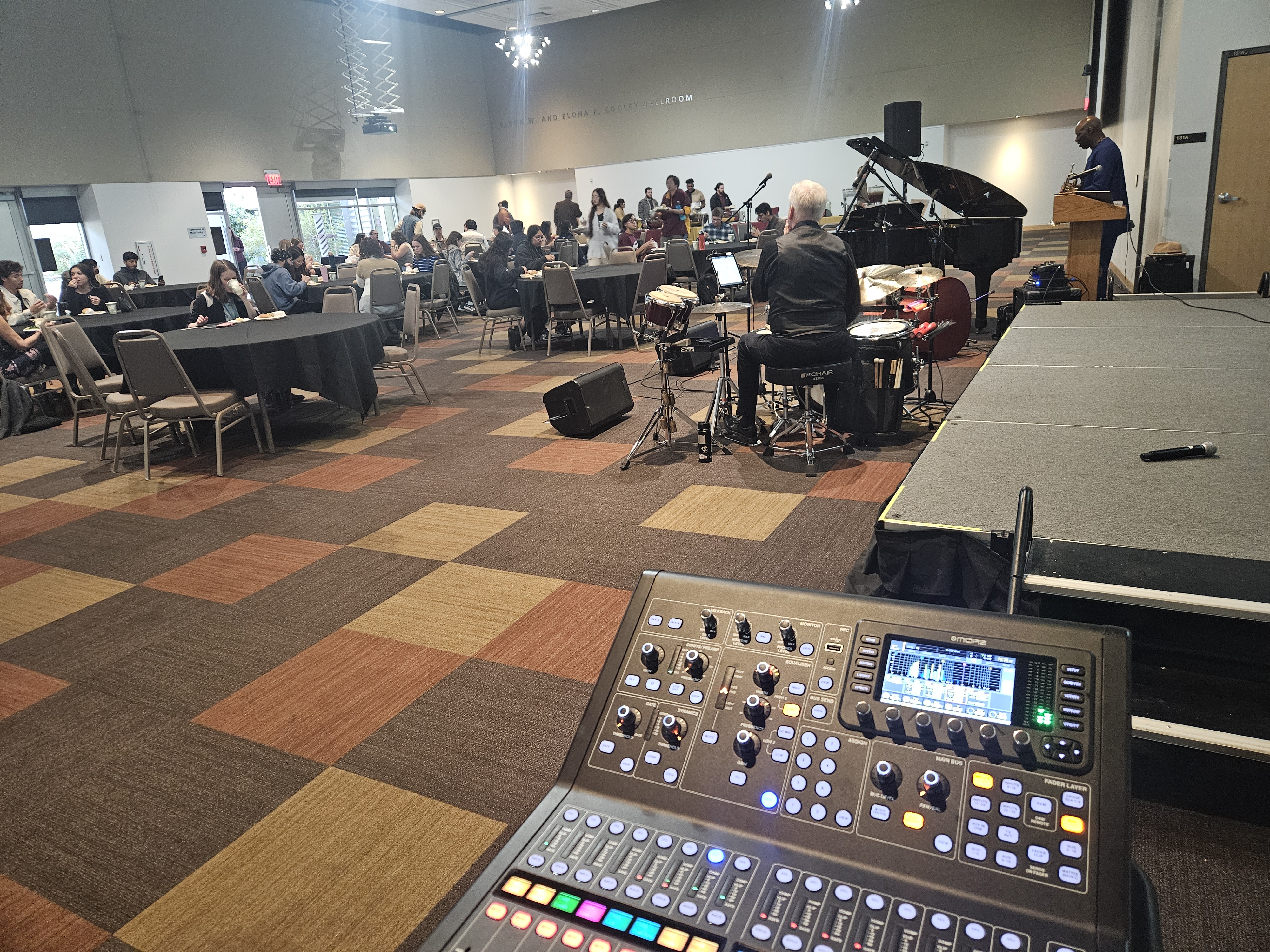Live musicians and a sound-control position at a Tempe gathering